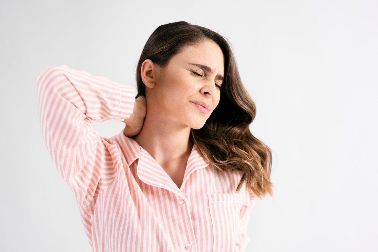 Young woman suffering from neck pain