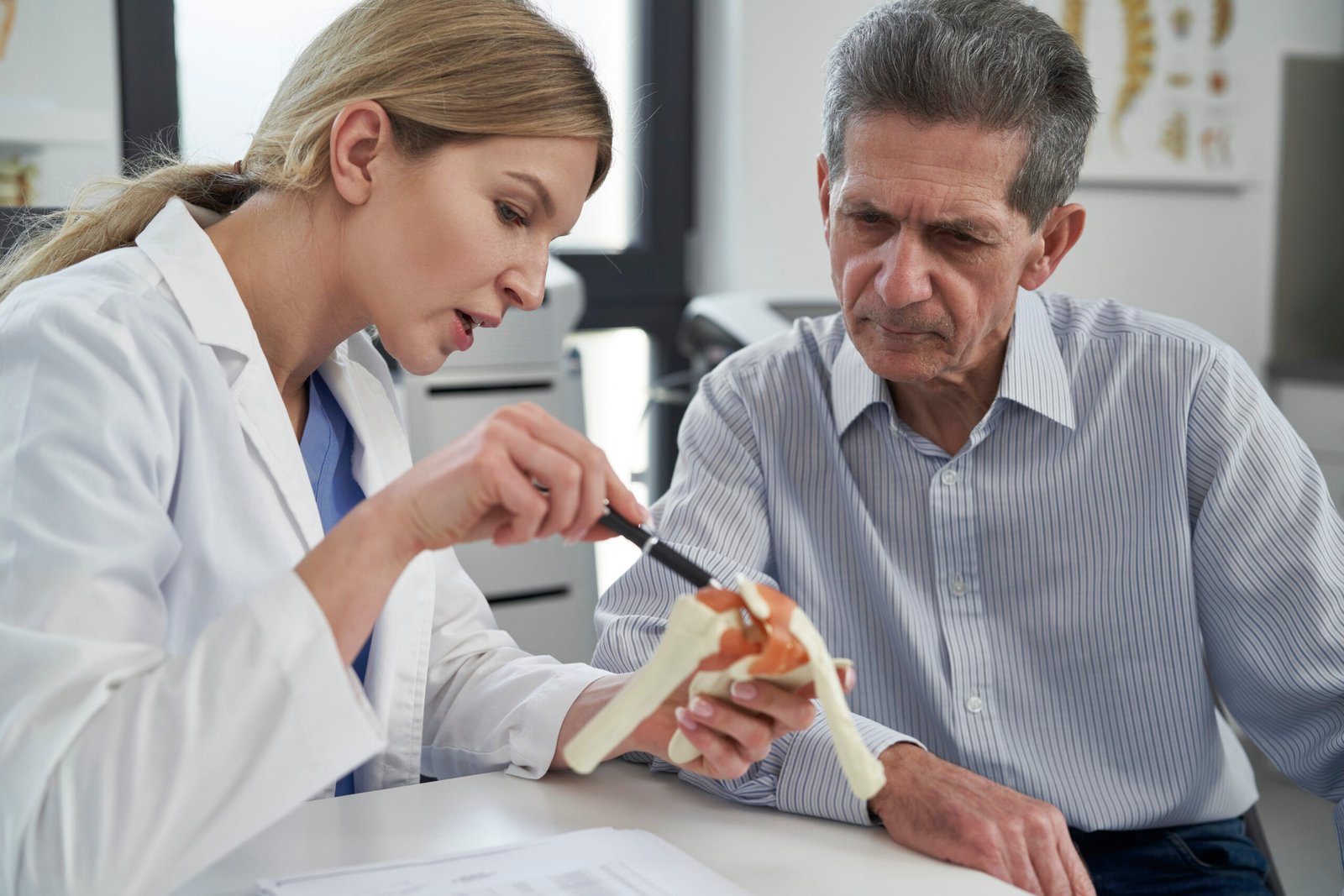 Female caucasian doctor talking with her patient
