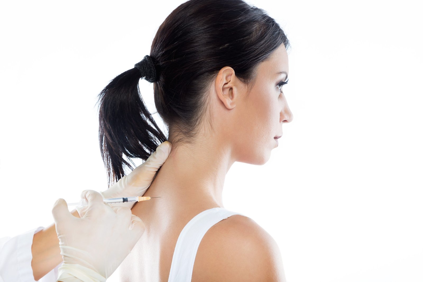 Portrait of surgeon making injection into female body. Neural therapy concept.